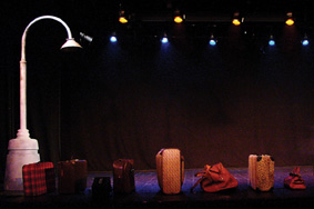 Empty stage and suitcases